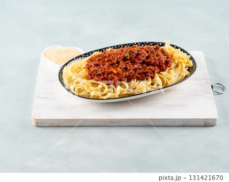 Tagliatelle with vegan tomato bolognese ragu with soya protein granules Tagliatelle with vegan tomato bolognese ragu with soya protein granules 131421670