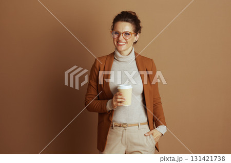 Smiling Businesswoman with Coffee Cup and Glasses 131421738