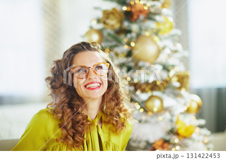 Woman Looking Up with Joy During Christmas Woman Looking Up with Joy During Christmas 131422453