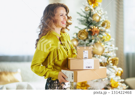 Joyful Woman with Christmas Deliveries 131422468
