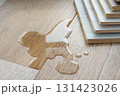 Laminate and water. Wooden floors are impervious to moisture. 131423026