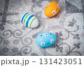 Easter. Multicolored eggs. Yellow and blue Easter decorations. 131423051