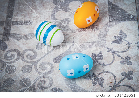 Easter. Multicolored eggs. Yellow and blue Easter decorations. 131423051