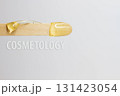 The inscription cosmetology on a wooden spatula with wax for hair removal. 131423054
