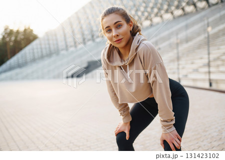 Fitness sport woman in sportswear doing sports on the street, outdoor sports. Active lifestyle. 131423102