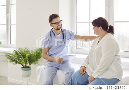 Overweight woman having consultation at doctor's office during medical examination in clinic. Overweight woman having consultation at doctor's office during medical examination in clinic. 131423832