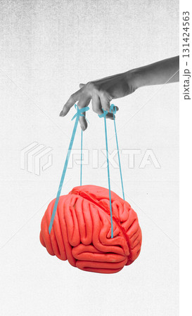 Trendy collage. Hand holding brain like puppet with strings on grey background Trendy collage. Hand holding brain like puppet with strings on grey background 131424563