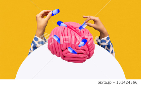 Graphic composition. Hands inserting capsules into pink brain symbolizing neuropharmacology Graphic composition. Hands inserting capsules into pink brain symbolizing neuropharmacology 131424566