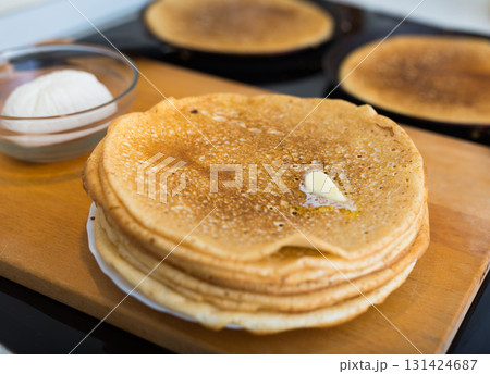 cooking traditional pancakes from wheat flour in the kitchen cooking traditional pancakes from wheat flour in the kitchen 131424687