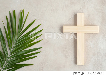 Palm Sunday symbol with wooden cross and green palm leaves, suitable for backgrounds Palm Sunday symbol with wooden cross and green palm leaves, suitable for backgrounds 131425892