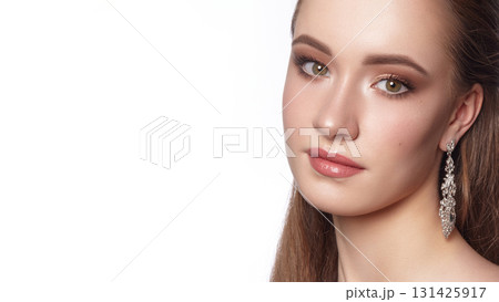 Close-up of Beautiful Model Woman with Fashion Hairstyle, Fresh Make-up on white backdrop with copy space. Prom or Bride Girl Style. Perfect for Beauty salon, Cosmetic Advertising or Makeup Artist Close-up of Beautiful Model Woman with Fashion Hairstyle, Fresh Make-up on white backdrop with copy space. Prom or Bride Girl Style. Perfect for Beauty salon, Cosmetic Advertising or Makeup Artist 131425917