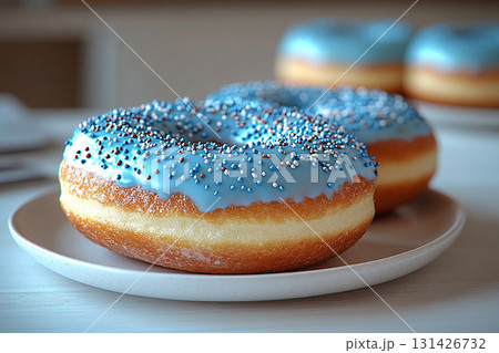 Home dessert. Glazed blue donuts. Donuts on a ceramic plate on a white background. Sweet topping food. Home dessert. Glazed blue donuts. Donuts on a ceramic plate on a white background. Sweet topping food. 131426732