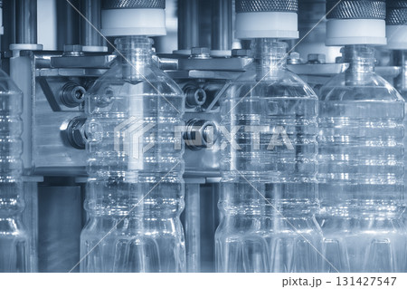 The mass production of drinking water on the conveyer belt. The mass production of drinking water on the conveyer belt. 131427547