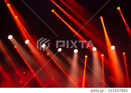 Stage white and red light beams on dark background. Stage lighting for concert. 131427885