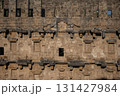 Part of the stone wall of the ancient amphitheater with architectural elements. 131427984