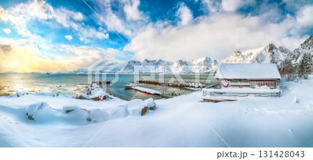 Amazing winter scenery with wooden houses in small fishing village and snowy mountain peaks near Valberg. Amazing winter scenery with wooden houses in small fishing village and snowy mountain peaks near Valberg. 131428043