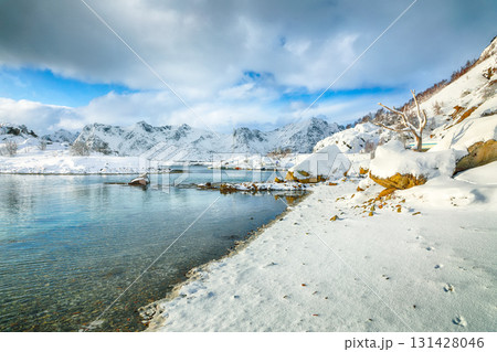 Amazing winter scenery with lots of snow in small fishing village and snowy mountain peaks near Valberg. Amazing winter scenery with lots of snow in small fishing village and snowy mountain peaks near Valberg. 131428046