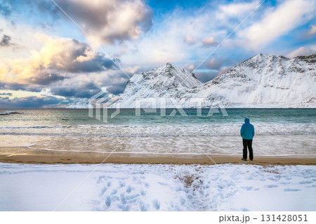 Amazing winter view of Vik beach during sunset with lots of snow  and snowy  mountain peaks near Leknes. 131428051