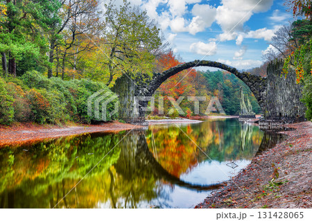 Breathtaking autumn landscape in Kromlau Rhododendron Park . Rakotz Bridge (Rakotzbrucke, Devil's Bridge) Breathtaking autumn landscape in Kromlau Rhododendron Park . Rakotz Bridge (Rakotzbrucke, Devil's Bridge) 131428065