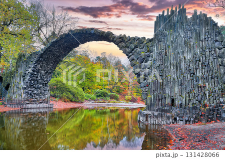 Breathtaking autumn landscape in Kromlau Rhododendron Park . Rakotz Bridge (Rakotzbrucke, Devil's Bridge) Breathtaking autumn landscape in Kromlau Rhododendron Park . Rakotz Bridge (Rakotzbrucke, Devil's Bridge) 131428066