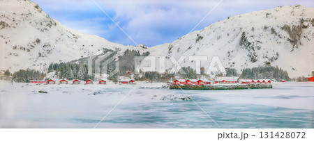 Amazing winter scenery with traditional Norwegian red wooden houses on the shore of Rolvsfjord. 131428072