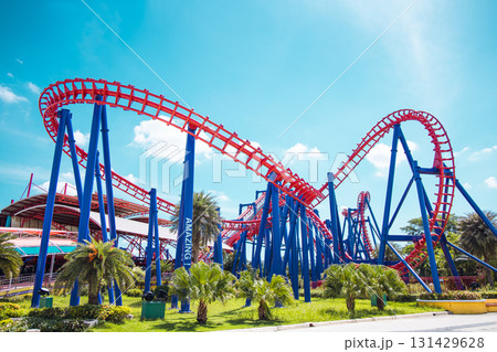 Roller coaster exciting fun amusement railroad track ride in Theme park. Roller coaster exciting fun amusement railroad track ride in Theme park. 131429628