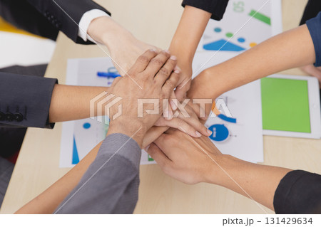 Closeup topview businesspeople join hand together.Stack of people hands. Unity and Team Teamwork Empower business worker for company concept. 131429634