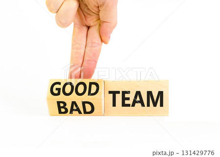 Good or bad team symbol. Concept words Good team Bad team on wooden cubes. Beautiful white table white background. Businessman hand. Business and good or bad team concept. Copy space. 131429776