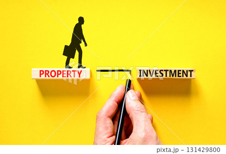 Property investment symbol. Concept words Property investment on beautiful wooden block. Businessman hand. Beautiful yellow paper background. Business Property investment concept. Copy space. Property investment symbol. Concept words Property investment on beautiful wooden block. Businessman hand. Beautiful yellow paper background. Business Property investment concept. Copy space. 131429800