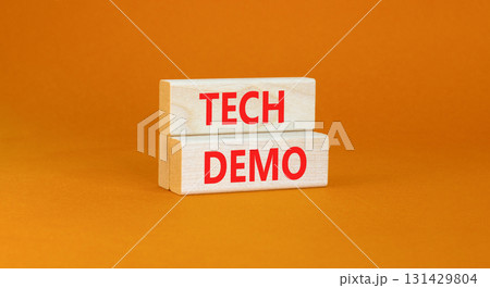 Tech demo symbol. Concept word Tech demo on beautiful wooden blocks. Beautiful orange paper background. Business tech demo concept. Copy space. Tech demo symbol. Concept word Tech demo on beautiful wooden blocks. Beautiful orange paper background. Business tech demo concept. Copy space. 131429804