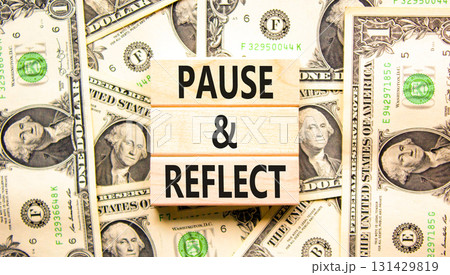 Pause and reflect symbol. Concept words Pause and reflect on beautiful block. Dollar bills. Beautiful background from dollar bills. Business motivational lifestyle pause and reflect concept Copy space 131429819