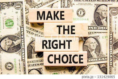 Make the right choice symbol. Concept words phrase Make the right choice on beautiful wooden blocks. Dollar bills. Beautiful dollar bills background. Business Make the right choice concept. Copy space Make the right choice symbol. Concept words phrase Make the right choice on beautiful wooden blocks. Dollar bills. Beautiful dollar bills background. Business Make the right choice concept. Copy space 131429865