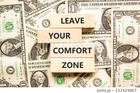 Leave your comfort zone symbol. Concept words Leave your comfort zone on beautiful wooden blocks. Beautiful dollar bills background. Business psychological Leave your comfort zone concept. Copy space. Leave your comfort zone symbol. Concept words Leave your comfort zone on beautiful wooden blocks. Beautiful dollar bills background. Business psychological Leave your comfort zone concept. Copy space. 131429867