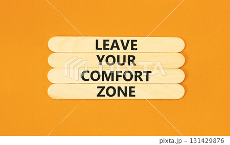 Leave your comfort zone symbol. Concept words Leave your comfort zone on beautiful wooden stick. Beautiful orange paper background. Business psychological Leave your comfort zone concept. Copy space. 131429876