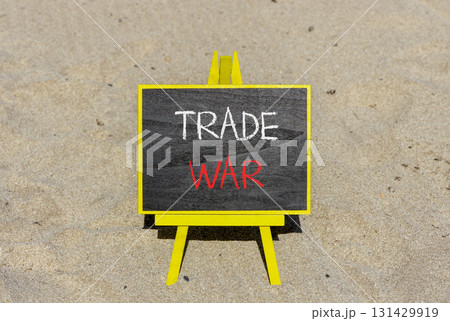 Trade war symbol. Concept word Trade war on beautiful black blackboard. Beautiful sand beach background. Black blackboard. Business trade war concept. Copy space. Trade war symbol. Concept word Trade war on beautiful black blackboard. Beautiful sand beach background. Black blackboard. Business trade war concept. Copy space. 131429919