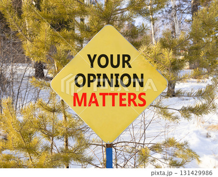 Your opinion matters symbol. Concept words Your opinion matters on beautiful yellow road sign. Beautiful snow forest background. Business your opinion matters concept. Copy space. 131429986