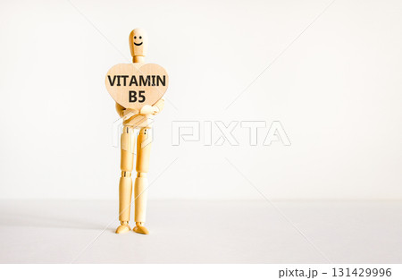 Vitamin B5 pantothenic acid symbol. Concept words Vitamin B5 on beautiful wooden heart. Doctor's model. Beautiful white background. Copy space. Medical healthy lifestyle Vitamin B5 concept. Vitamin B5 pantothenic acid symbol. Concept words Vitamin B5 on beautiful wooden heart. Doctor's model. Beautiful white background. Copy space. Medical healthy lifestyle Vitamin B5 concept. 131429996