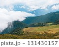 Lush green hills and valleys under a cloudy sky, showcasing the beauty of nature with rolling landscapes and distant mountains, creating a serene outdoor atmosphere 131430157