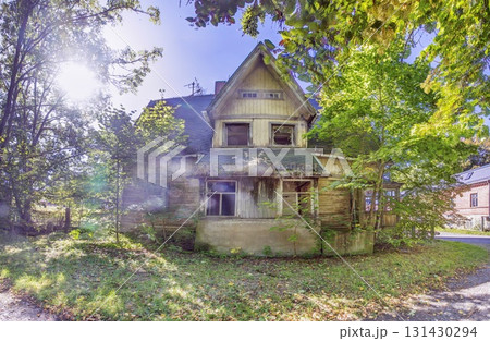 Abandoned wooden house in sunlight Abandoned wooden house in sunlight 131430294