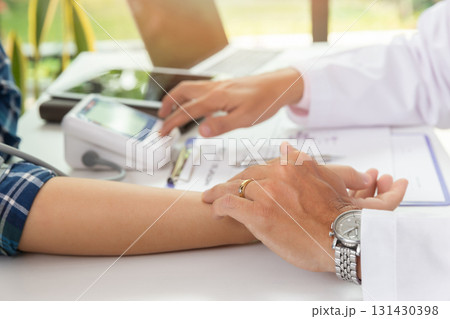 Doctor examining patient pulse by hands. Healthcare and medical service. Doctor examining patient pulse by hands. Healthcare and medical service. 131430398