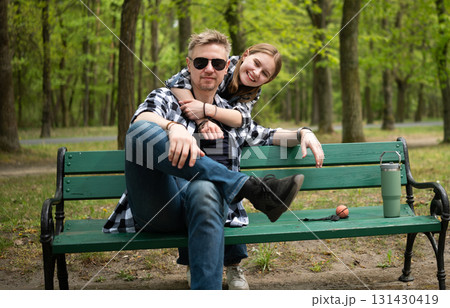 Happy Father And Little Daughter Hugging In Park In Family Look Happy Father And Little Daughter Hugging In Park In Family Look 131430419