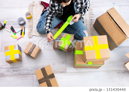 Girl Packing Cardboard Boxes For Shipping And Packing Cardboard Boxes Girl Packing Cardboard Boxes For Shipping And Packing Cardboard Boxes 131430440