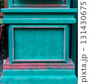 Vibrant green teal wall with textured surface and contrasting red accents, showcasing architectural details and artistic expression, creative design and visual storytelling, background with copy space 131430675