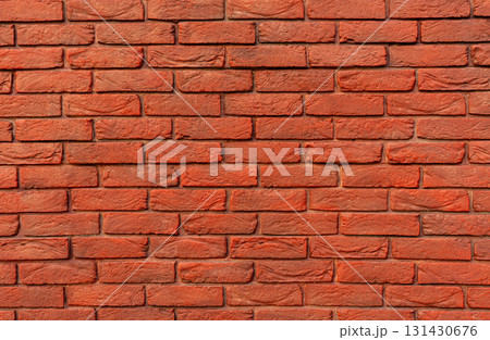 Close-up view of red brick wall featuring various textures and color tones, craftsmanship and strength of traditional masonry work, background with copy space Close-up view of red brick wall featuring various textures and color tones, craftsmanship and strength of traditional masonry work, background with copy space 131430676