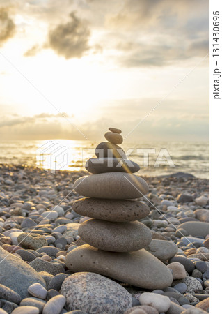 Cairn made of pebbles on the sea shore. 131430696