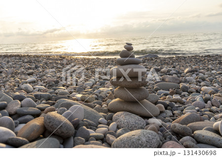 Cairn made of pebbles on the sea shore. 131430698
