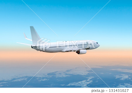 White passenger jet plane flies in the air above the clouds White passenger jet plane flies in the air above the clouds 131431027