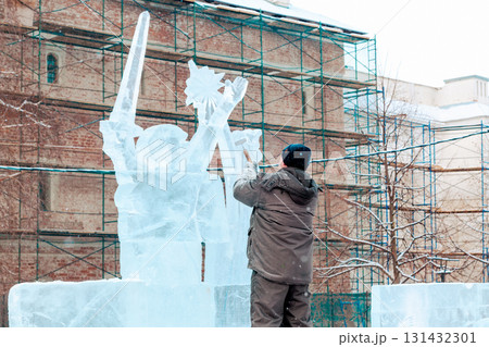 Vologda, Russia - February 15, 2025. Ice sculpture creation on the city's central square Vologda, Russia - February 15, 2025. Ice sculpture creation on the city's central square 131432301