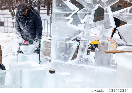 Vologda, Russia - February 15, 2025. Ice sculpture creation on the city's central square Vologda, Russia - February 15, 2025. Ice sculpture creation on the city's central square 131432334