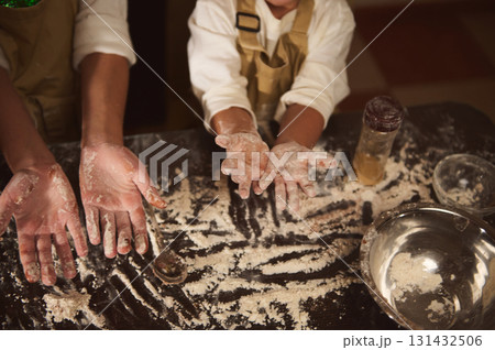 Family Baking Fun: Floury Hands of Kids and Adults in a Cozy Kitchen Family Baking Fun: Floury Hands of Kids and Adults in a Cozy Kitchen 131432506